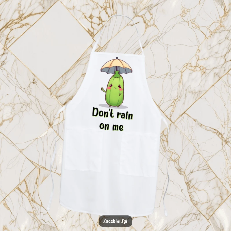Funny zucchini looking perplexed while balancing a tiny umbrella on its head, featured on a humorous kitchen apron.