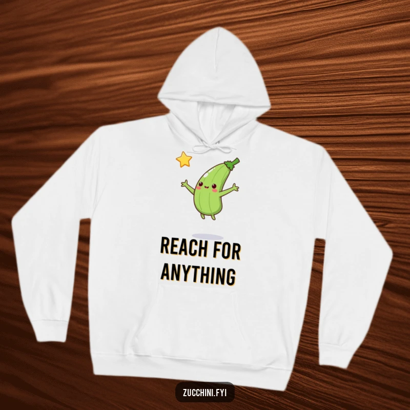 Funny Jumping Zucchini Hoodie: A zucchini jumps to catch a falling star, designed for cozy comfort and inspirational, humorous wear.