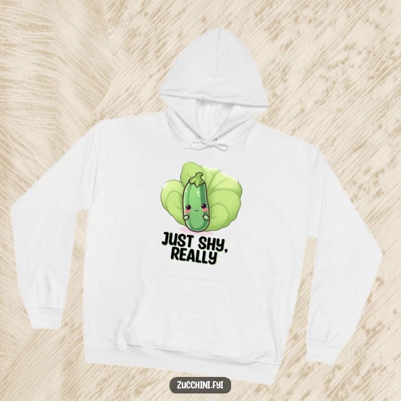 Funny kawaii zucchini peeking shyly from behind a leaf on a warm hoodie, representing quiet humor and cuteness, a perfect gift.