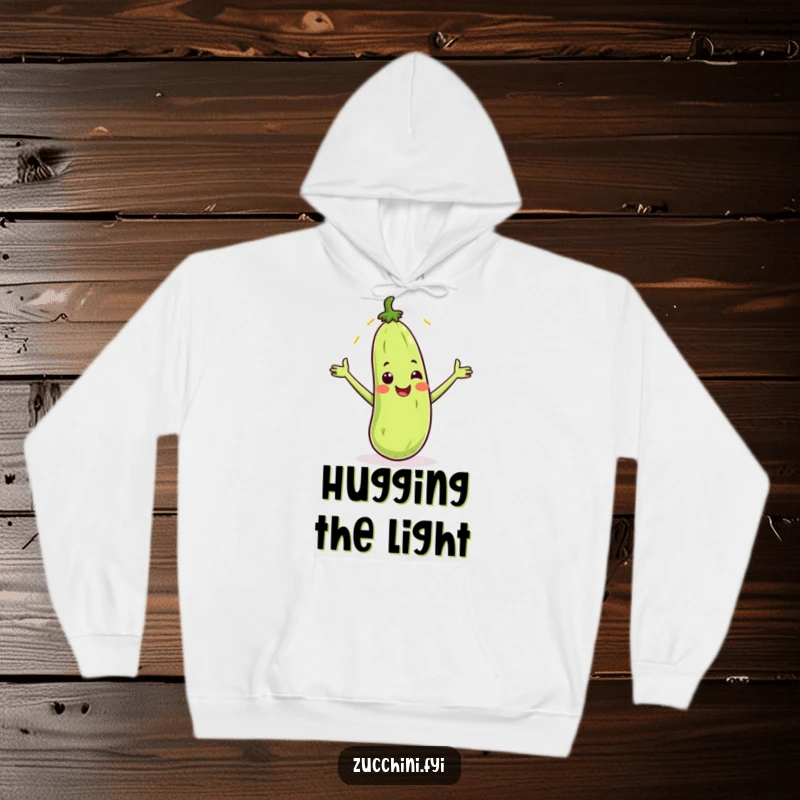 Funny hoodie with a smiling zucchini catching a sunbeam, offering cozy comfort and cheerful, humorous vibes.