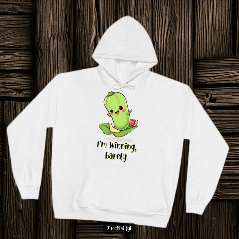Funny hoodie with a cheerful zucchini racing a snail on a leaf, offering humorous warmth and a playful design.